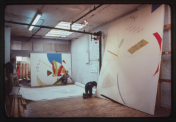 asst. Peter Stevens helping artist William Conlon select Paintings for Museum of Art - Carnegie Institute exhibition. Broome Street Studio, 1981